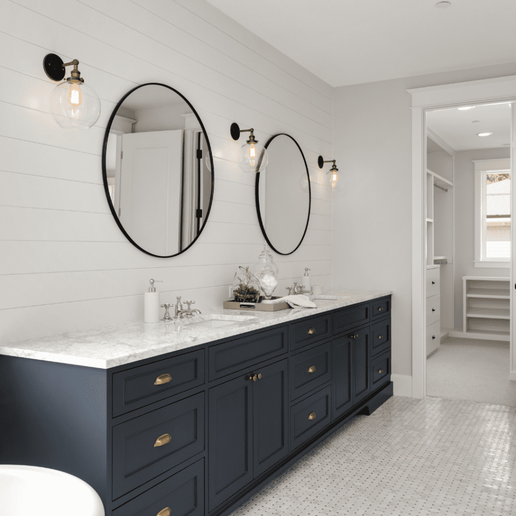 Dark blue bathroom cabinet in white bathroom
