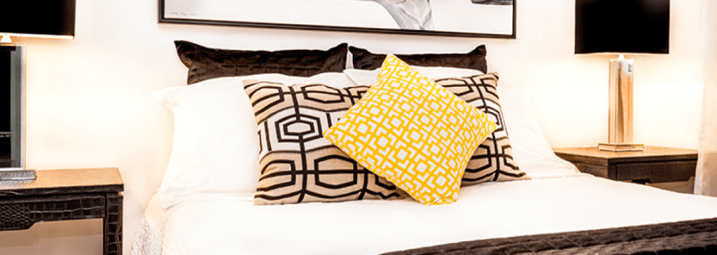 Yellow cushions on bed