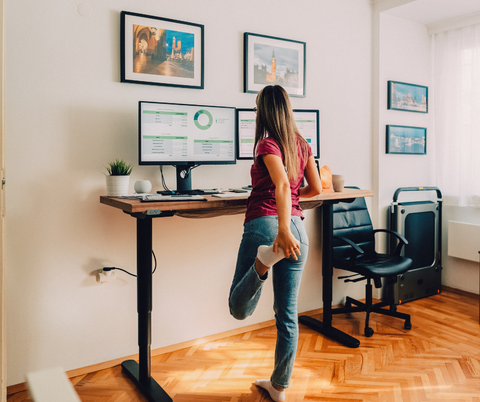 Lady at standing desk looking at computer