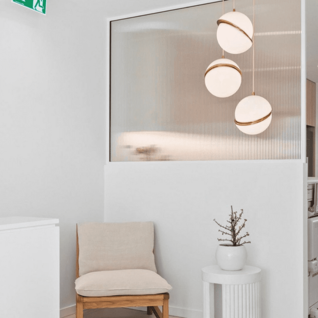 Pendant Lighting in a white room with chair